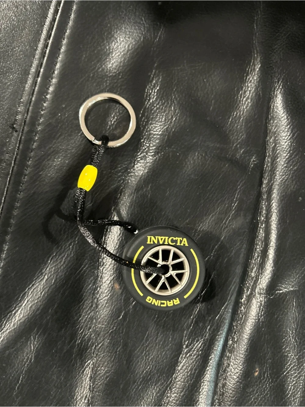 Invicta Black tire Keychain with Yellow Accent